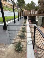 Rod railing on concrete walls