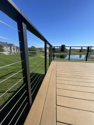 Deck cable railing overlooking a pond