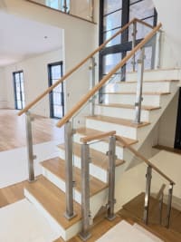 Stainless post glass railing on stair