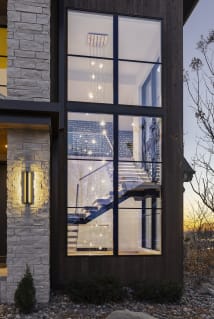 Floating stair seen through two-story window