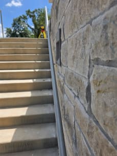 Exterior stair wall handrail