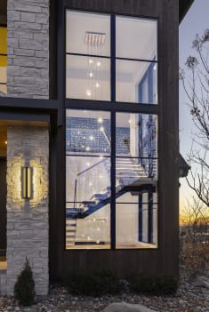 Floating stair seen through two-story window