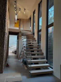 Floating stair with glass railing in progress