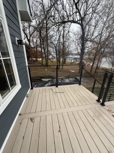 Deck corner with black cable railing