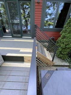 Deck stair with black cable railing