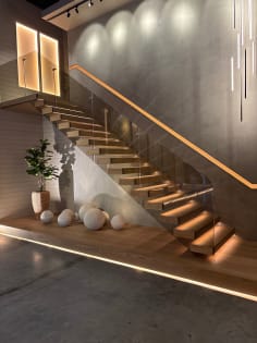 Floating stair with bronze glass and LED