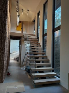 Floating stair with glass railing in progress