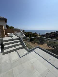 Stepped terrace with base-rail glass railing