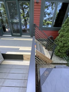 Deck stair with black cable railing