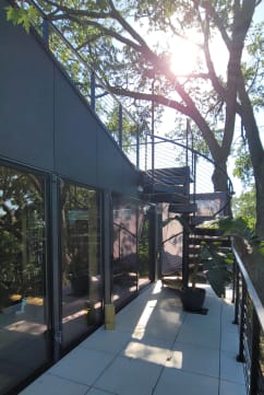 Balcony walkway with spiral stair and cable railing