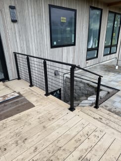Black cable railing on a deck