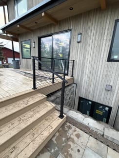 Black cable railing on a deck