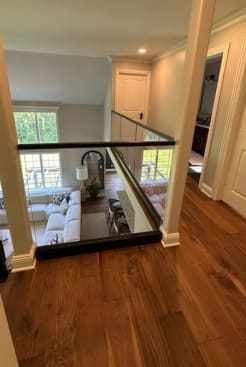 Glass loft railing with black cap