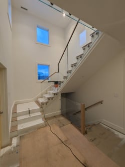 Standoff-pin glass railing on stair
