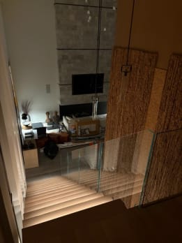 Glass railing over lit stair