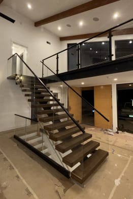 FLIGHT Mono stair with glass railing and post-glass loft
