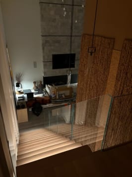 Glass railing over lit stair