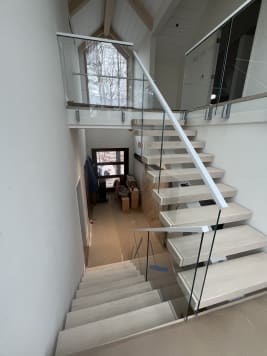 White oak floating stair with glass