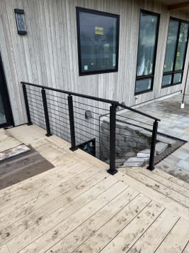 Black cable railing on a deck