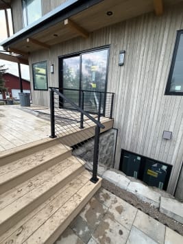 Black cable railing on a deck
