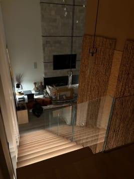Glass railing over lit stair