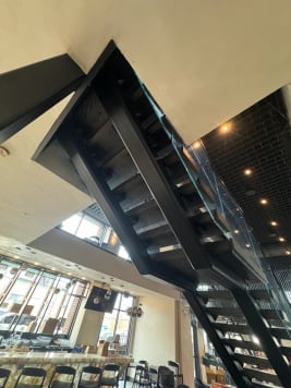 Commercial steel stair with glass railing
