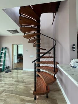 Wood spiral stair with cable railing