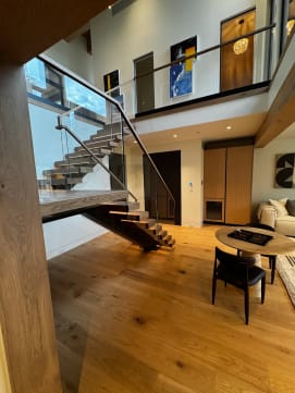 Floating stair and glass balcony