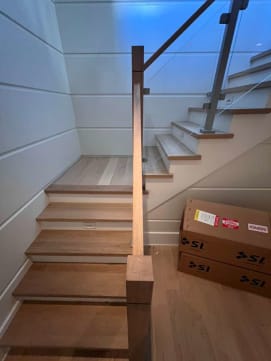 Post-to-post glass railing with wood newels