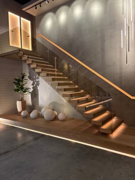 Floating stair with bronze glass and LED