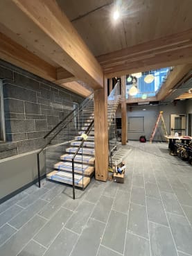 Commercial floating stair with glass