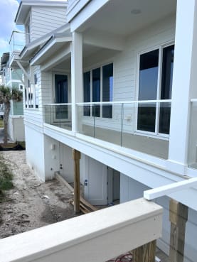 Glass porch railing on beach house