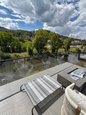 Rooftop glass railing over river