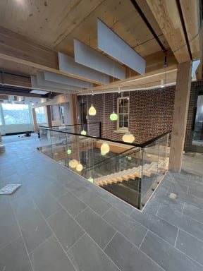 Commercial floating stair with glass