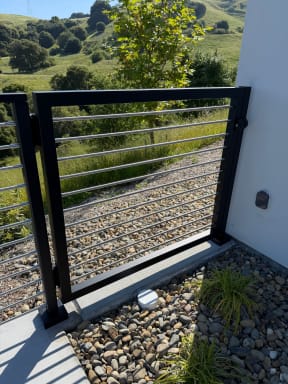 Rod railing gate on patio
