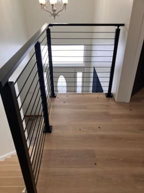 Onyx rod railing at stair opening