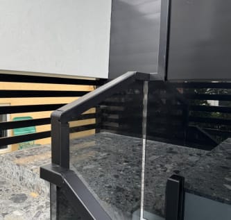 Glass railing cap rail fitting detail