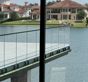 Glass base-rail balcony over water