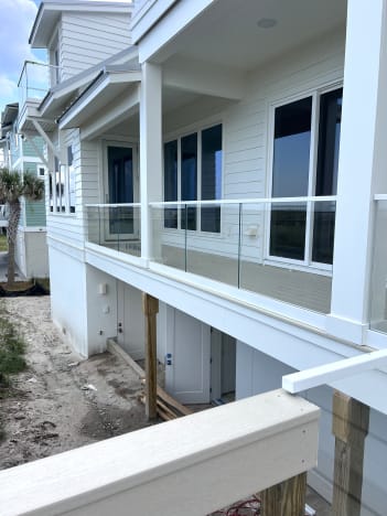 Glass porch railing on beach house