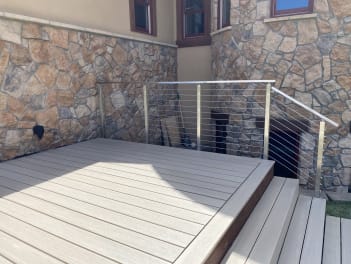 Composite deck with stainless cable railing