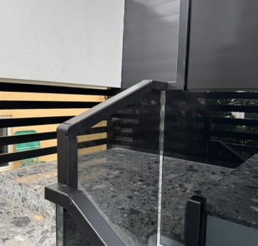 Glass railing cap rail fitting detail