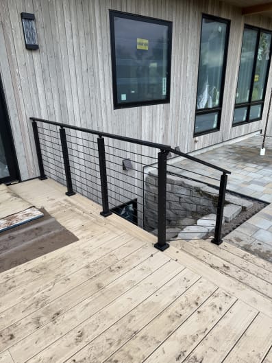 Black cable railing on a deck