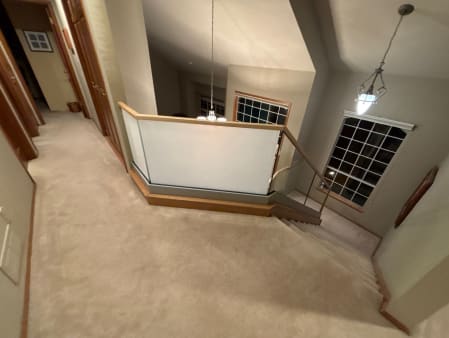 Frosted and clear glass railing with wood cap