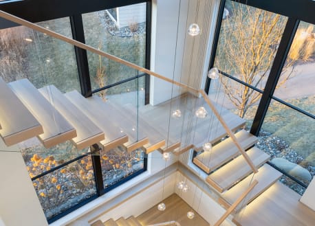 Wide floating treads near windows