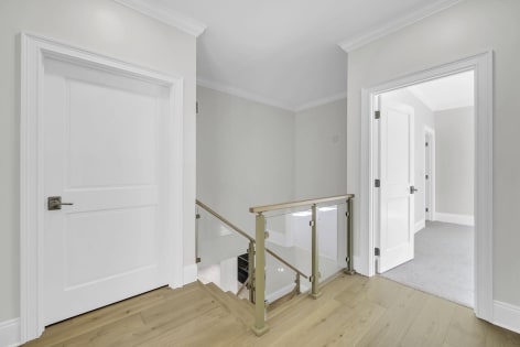 Landing with brass posts and glass