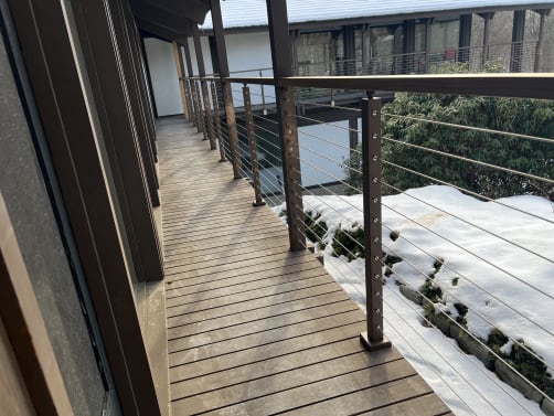 Cable railing on wraparound balcony