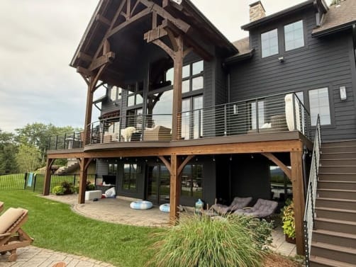 Timber-frame home deck with cable railing