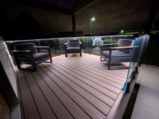 LED glass railing on deck at night