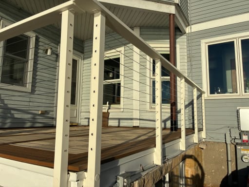 White side-mount cable railing on porch