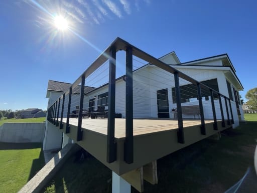 Corner of raised deck with cable railing